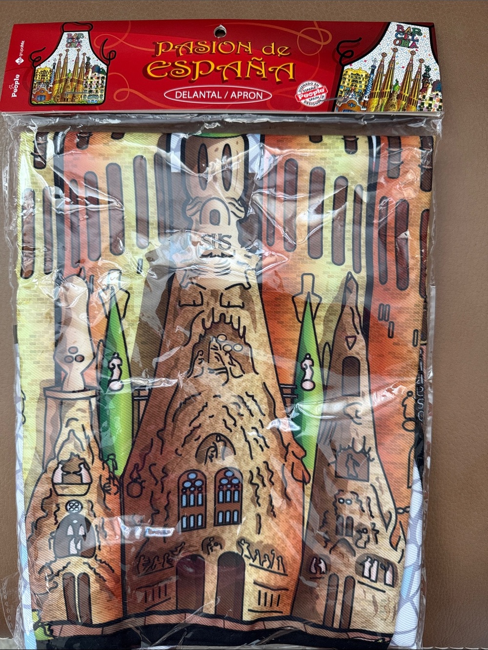 Spain’s Familia Chef Apron-Orange & Green Sagrada Família Design